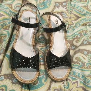 Wedged kids high heal shoes. Has a velcro strap.